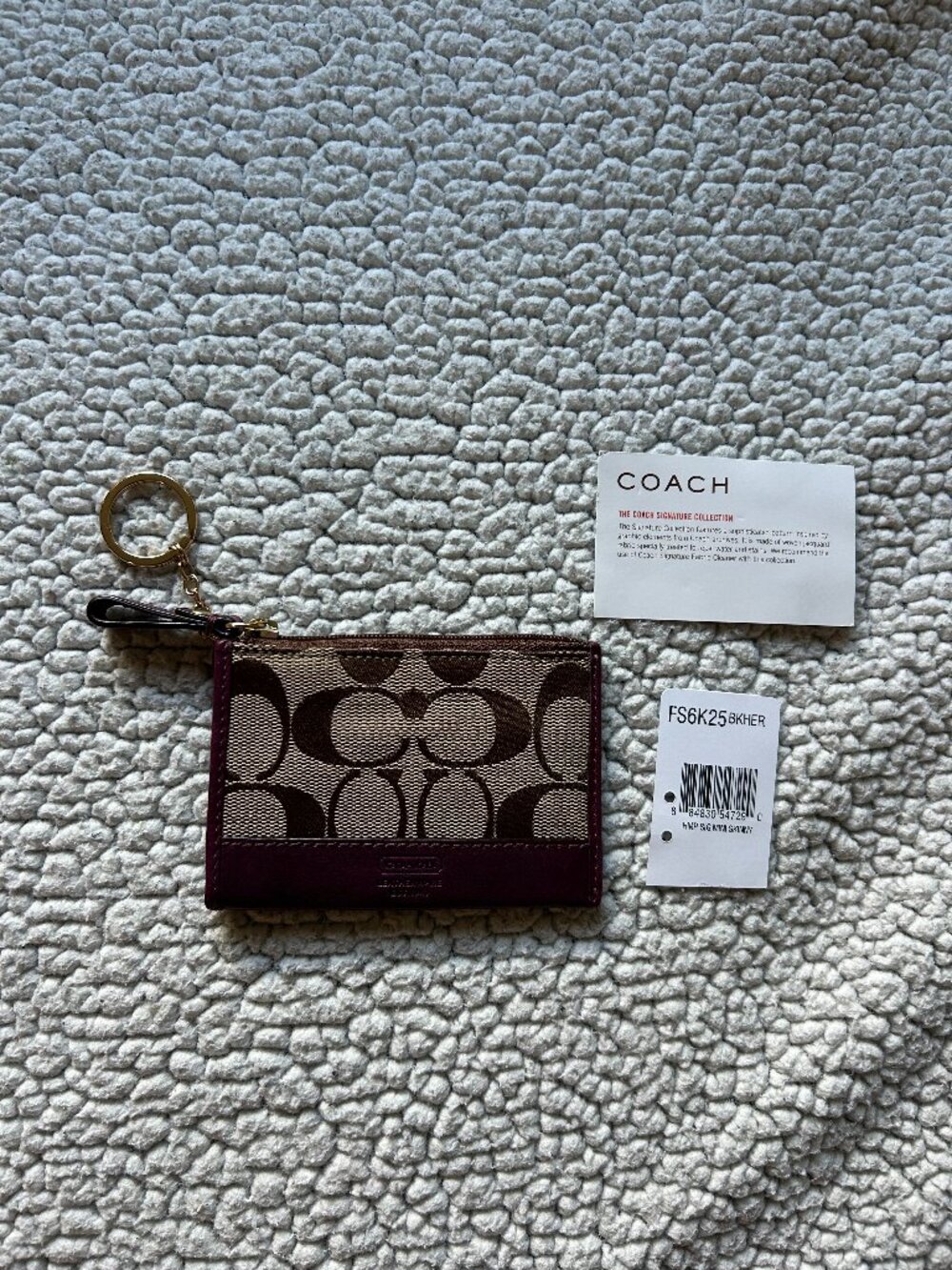 Coach -- tan brown/ signature keychain coin pouch, purple leather trim